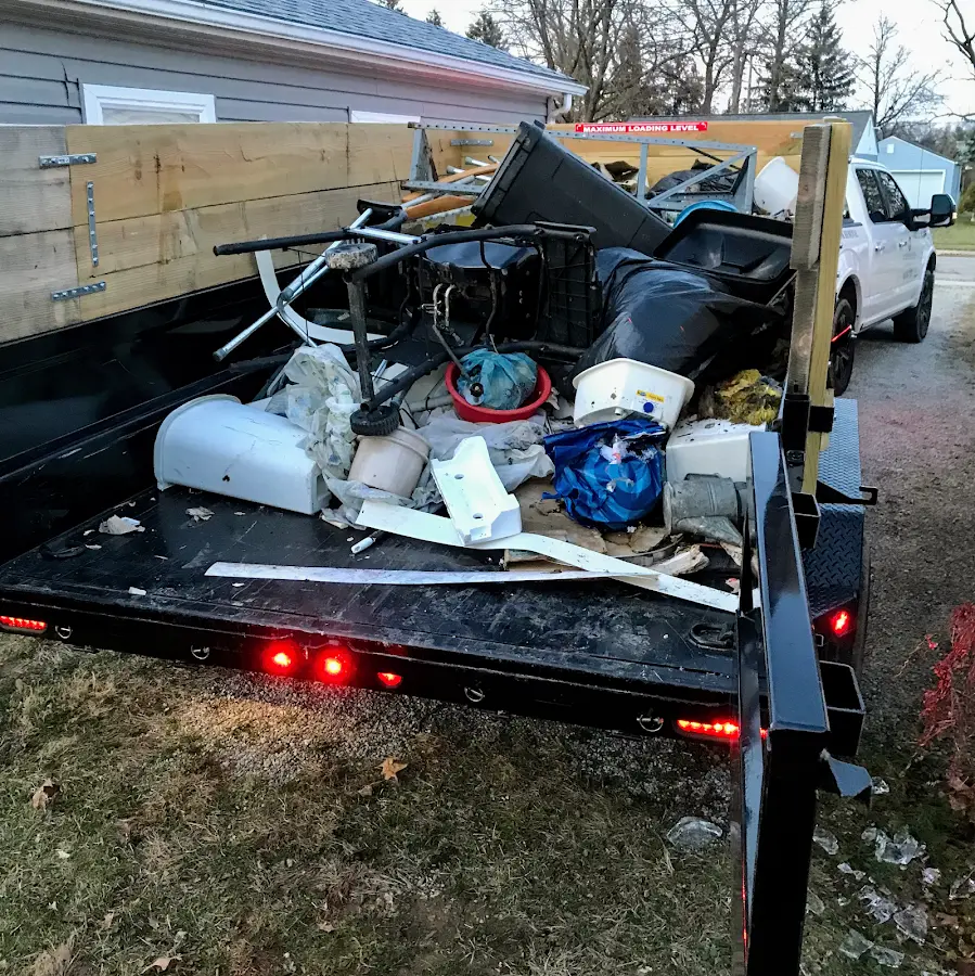 Roll-off dumpster delivered to a residential driveway in Northport